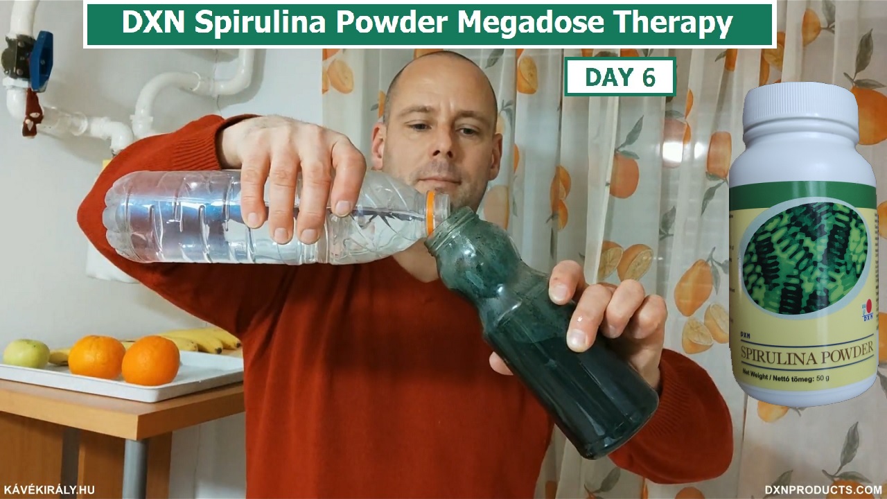 Pouring water on DXN Spirulina Powder in a bottle
