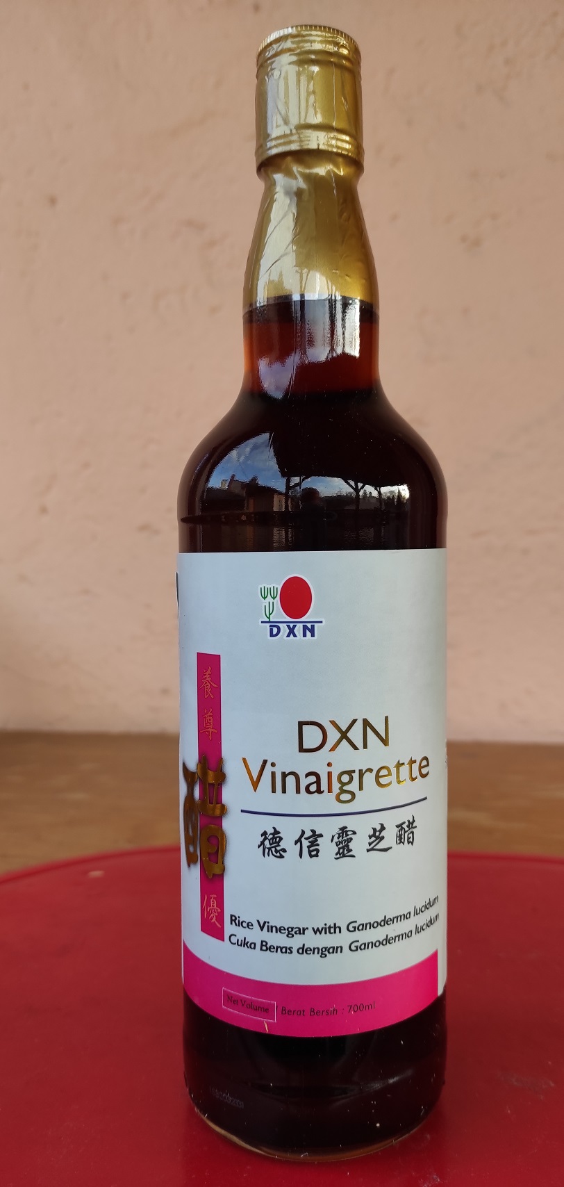 Red yeat rice vinegar with Reishi mushroom extract from DXN beautiful bottle